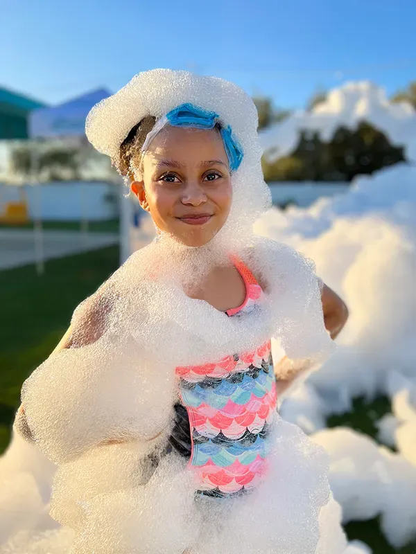 Girl wearing foam goggles at a Sacramento foam party